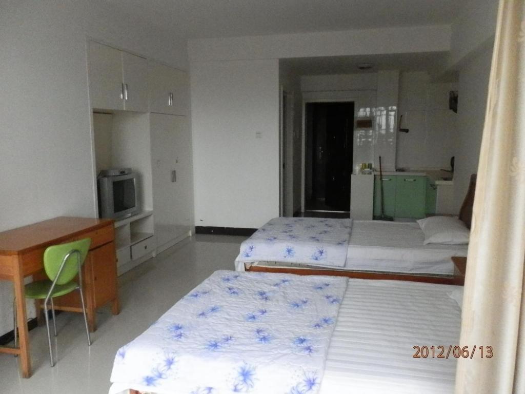Xingfu Hotel Nanning Habitación foto